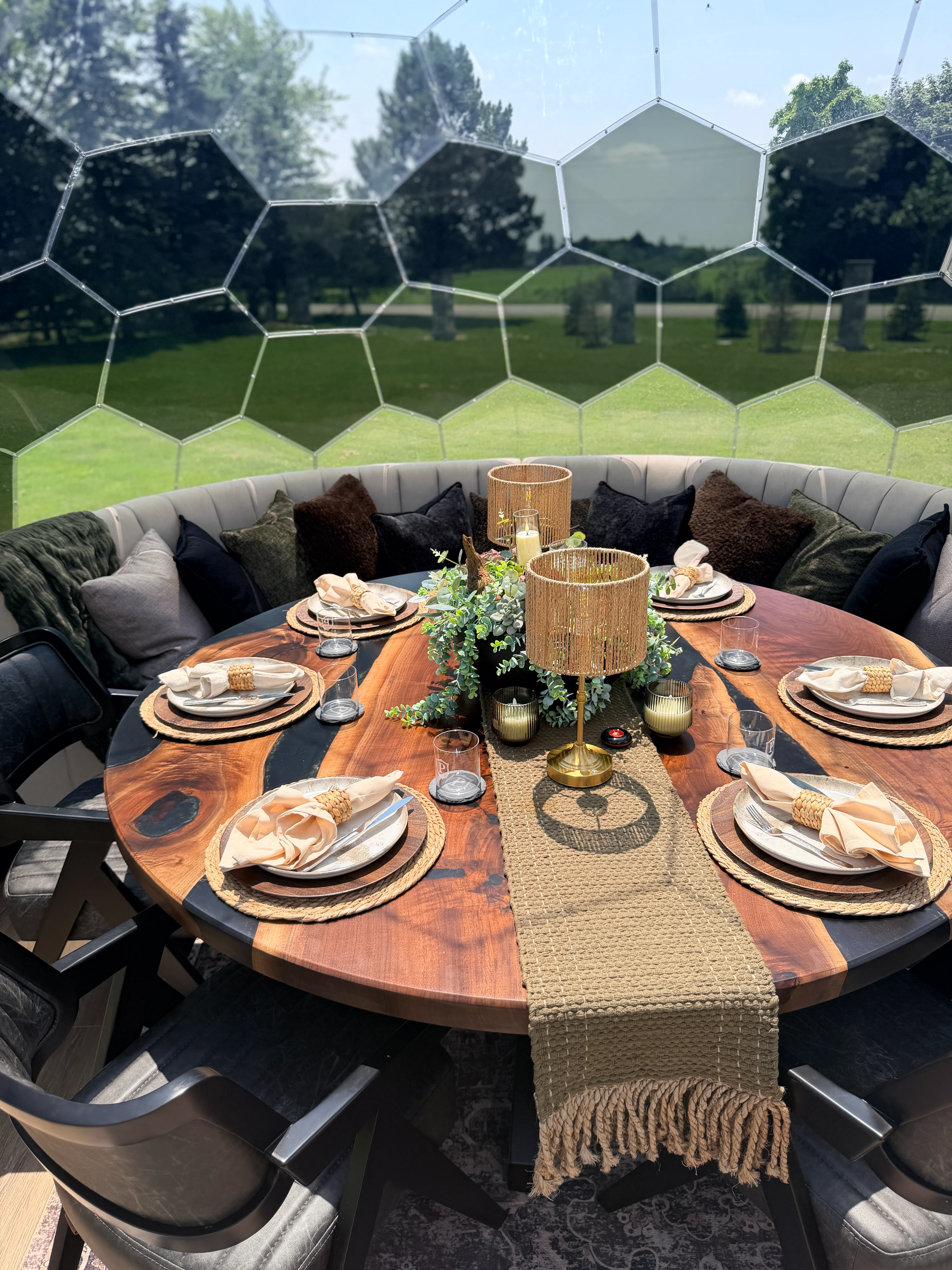 Private dome interior with a candlelit table set for dinner